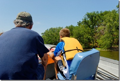 120730498tb Luke driving boat with Grandpa